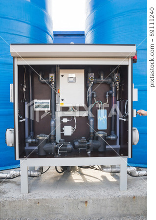 Blue water tower pump complex's switch box with a monitor, valves and buttons 89111240