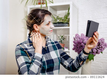 Good-looking caucasian woman with mask on face. Face care concept.  89111624