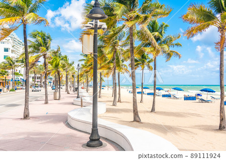 Seafront beach promenade with palm trees on a sunny day in Fort Lauderdale Seafront beach promenade with palm trees on a sunny day in Fort Lauderdale 89111924