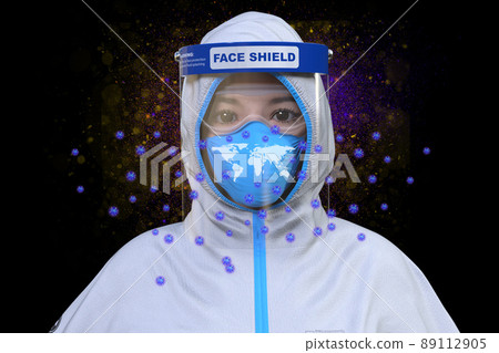A medical worker with a world map projected on a mask protected by a face shield to prevent the infection of floating viruses A medical worker with a world map projected on a mask protected by a face shield to prevent the infection of floating viruses 89112905