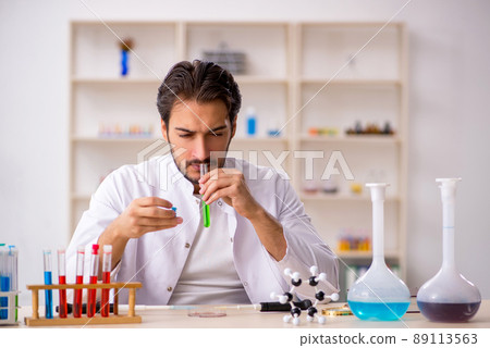 Young male chemist working at the lab Young male chemist working at the lab 89113563