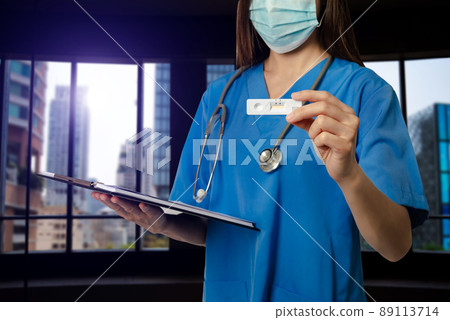 .COVID-19 virus disease diagnostic,doctor holding Coronavirus test cassette,rapid strep (RST) kit,quick antigen detection testing 89113714