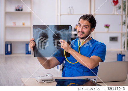Young male doctor radiologist working in the clinic 89115043