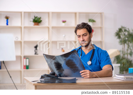 Young male doctor radiologist working in the clinic 89115538