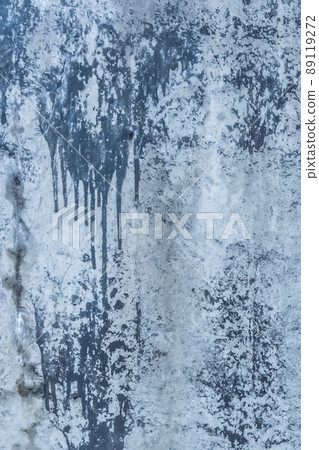 Blue painted concrete surface old stained paint wall texture spilled cement streaks background 89119272