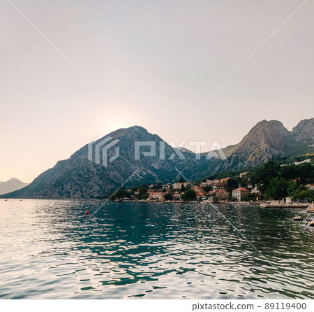 Sunset, beautiful landscape with silhouettes of trees. Travel concept. Montenegro, Kotor Bay. Sunset at Kotor Bay Montenegro. View of the sunset in Boko-Kotor Bay in Montenegro. Silhouettes of 89119400