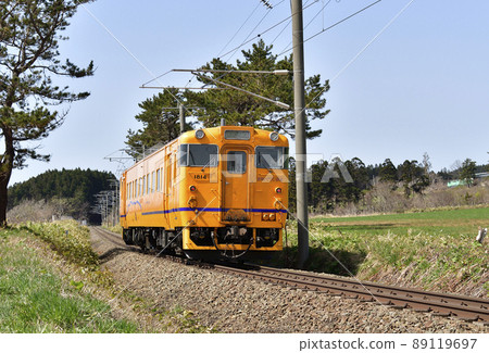 Photographing the scenery of a regular train of the South Hokkaido Railway in Hokuto City, Hokkaido in the spring 89119697