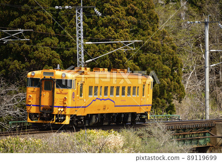 Photographing the scenery of a regular train of the South Hokkaido Railway in Hokuto City, Hokkaido in the spring 89119699