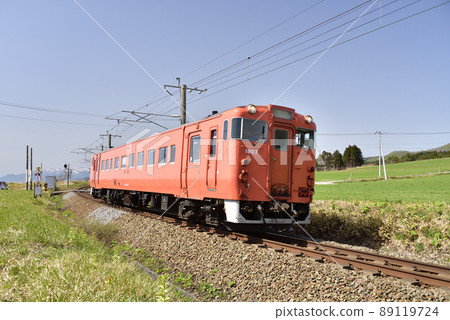 Photographing the scenery of a regular train of the South Hokkaido Railway in Hokuto City, Hokkaido in the spring 89119724