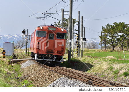 Photographing the scenery of a regular train of the South Hokkaido Railway in Hokuto City, Hokkaido in the spring 89119731