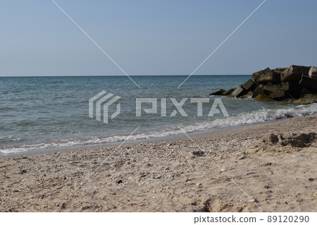 The sky was clear and the waters of the sea beat on the rocks The sky was clear and the waters of the sea beat on the rocks 89120290