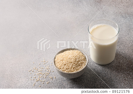 Vegan plant based sesame milk on gray background. 89121576