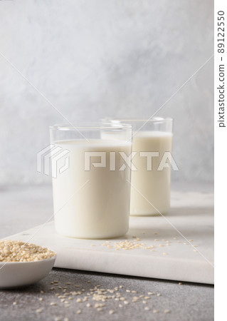 Sesame plant based milkin glasses. Vegan non dairy alternative milk. 89122550