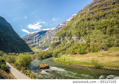 Deep valley with river of Norwegian fjords close the train journey Flamsbana between Flam and Myrdal in Aurland in Western Norway 89123109