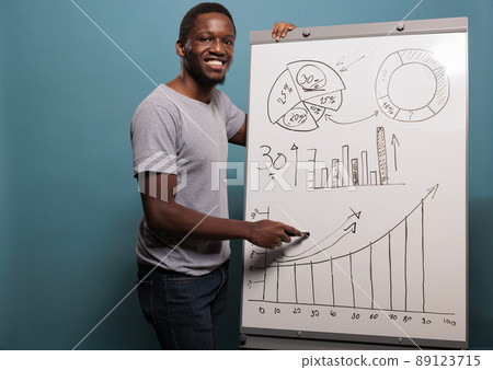 Office assistant doing project presentation with charts and financial statistics on white board over blue background. Consultant manager using business placard for advertisement. 89123715