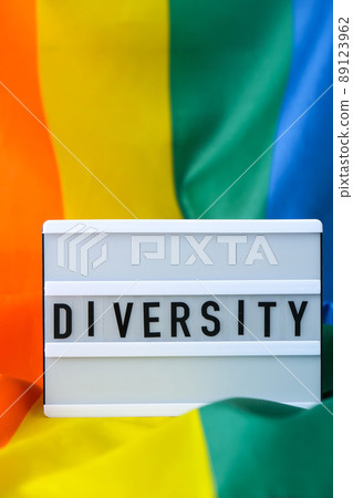 Rainbow flag with lightbox and text DIVERSITY. Rainbow lgbtq flag made from silk material. Symbol of LGBTQ pride month. Equal rights. Peace and freedom Rainbow flag with lightbox and text DIVERSITY. Rainbow lgbtq flag made from silk material. Symbol of LGBTQ pride month. Equal rights. Peace and freedom 89123962