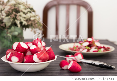 cooked crispy radish in white bowl on wooden table cooked crispy radish in white bowl on wooden table 89124733