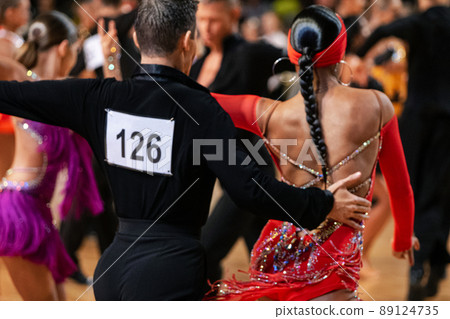 couple dancers on background of dancing athletes couple dancers on background of dancing athletes 89124735