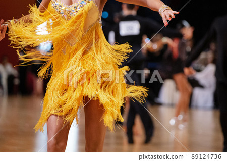 female dancer in yellow dress in dance competition female dancer in yellow dress in dance competition 89124736