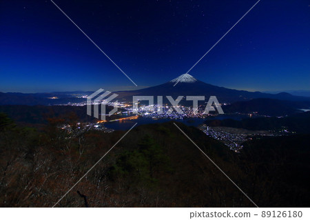 Night view of Mt. Fuji and Lake Kawaguchi seen from the Misaka Mountains Night view of Mt. Fuji and Lake Kawaguchi seen from the Misaka Mountains 89126180