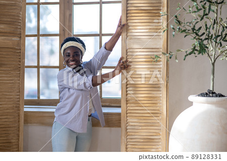 African american woman standing near the window African american woman standing near the window 89128331