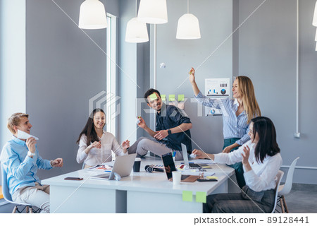 Business people playing and having fun in the office. Business people playing and having fun in the office. 89128441