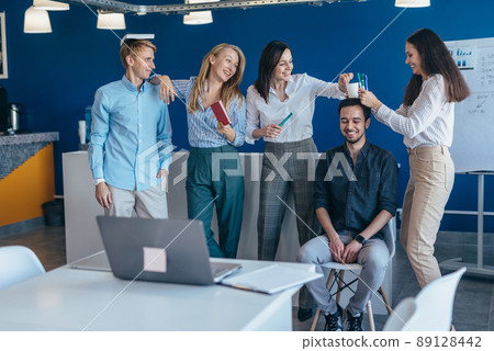 Group of young people in class talking and joking 89128442