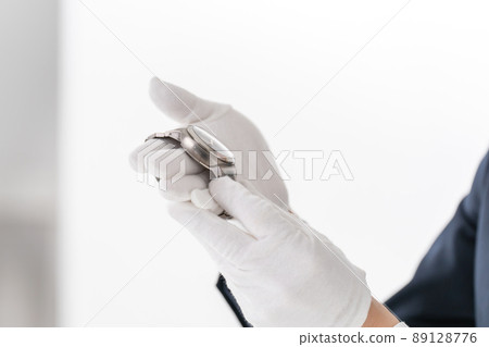 Pawn shop appraisal watch male hand 89128776