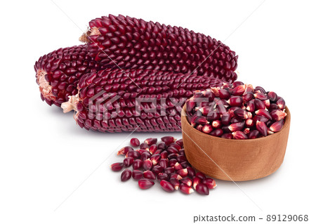 Purple corn seeds in wooden bowl isolated on white background with full depth of field Purple corn seeds in wooden bowl isolated on white background with full depth of field 89129068