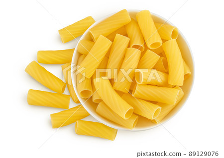 raw italian Rigatoni pasta in ceramic bowl isolated on white background with clipping path and full depth of field. Top view. Flat lay raw italian Rigatoni pasta in ceramic bowl isolated on white background with clipping path and full depth of field. Top view. Flat lay 89129076
