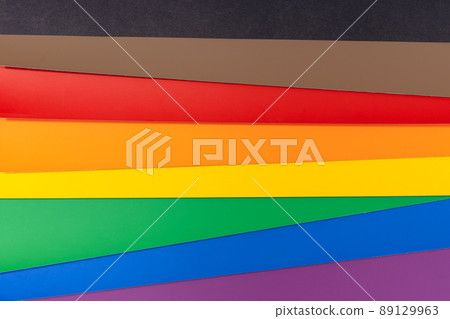 New LGBT Rainbow flag background with black and brown stripes. Group of colored cardboard. Gay pride flag 89129963