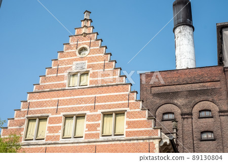 MECHELEN, Malines, Antwerp, BELGIUM, March 2, 2022, Old facades, roofs and chimney of the beer 89130804
