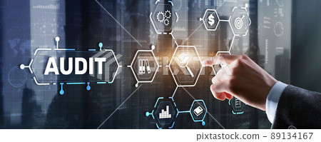 Audit. Checking the financial statements of the company. Businessman touching Audit on 3d icon on virtual screen Audit. Checking the financial statements of the company. Businessman touching Audit on 3d icon on virtual screen 89134167