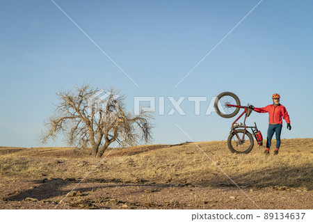 senior male cyclist with a fat mountain bike senior male cyclist with a fat mountain bike 89134637