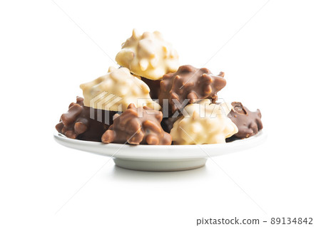 Chocolate truffles. Sweer pralines isolated on white background. Chocolate truffles. Sweer pralines isolated on white background. 89134842