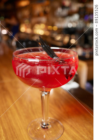 Italian cocktail with orange slices on gray stone table. Summer drink, homemade. 89135526
