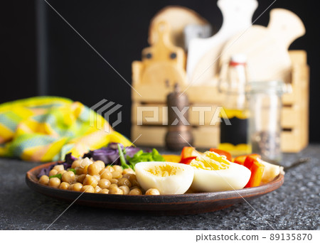 Salad - Flavor Dish Made From Tomato, Cucumber, Red cabbage, and Parsley, Chickpeas Served With Hard Boiled Egg and Tahini Sauce Salad - Flavor Dish Made From Tomato, Cucumber, Red cabbage, and Parsley, Chickpeas Served With Hard Boiled Egg and Tahini Sauce 89135870