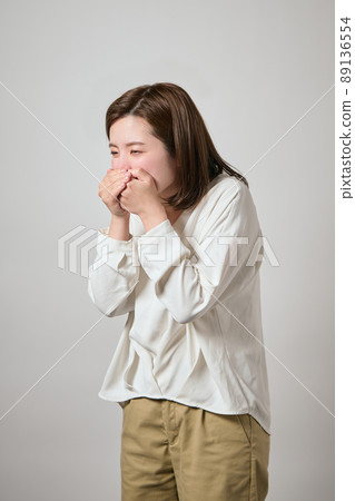 A young woman who feels sick and feels nauseous A young woman who feels sick and feels nauseous 89136554