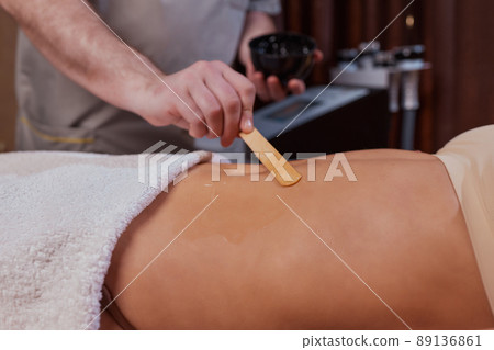 procedure removing cellulite on female abdomen, cavitation belly massage. Ultrasonic massage for weight loss. Correction of female figure without surgical intervention. Closeup of the tummy. procedure removing cellulite on female abdomen, cavitation belly massage. Ultrasonic massage for weight loss. Correction of female figure without surgical intervention. Closeup of the tummy. 89136861