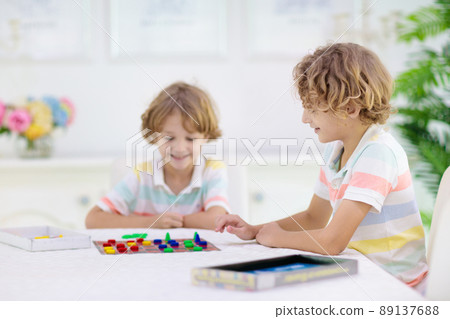 Family playing board game. Kids play. Family playing board game. Kids play. 89137688