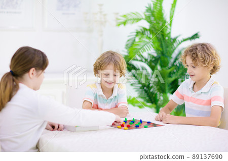 Family playing board game. Kids play. Family playing board game. Kids play. 89137690