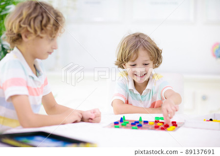 Family playing board game. Kids play. Family playing board game. Kids play. 89137691