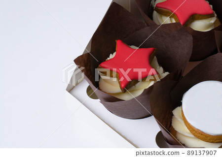 cupcakes with cream and red stars on a white background 89137907