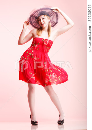Beautiful woman happy screaming in red dress 89138033