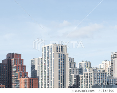 New residential district of Moscow. Modern architecture of apartment buildings. Horizontal banner with clear blue sky. Russia. 89138190