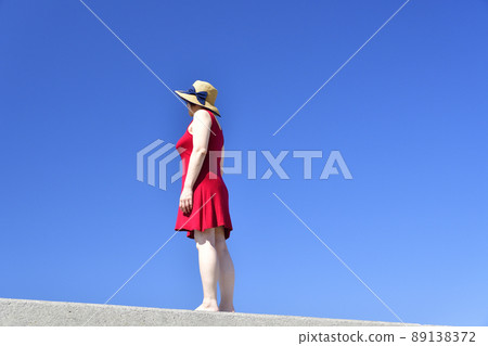 Taking a portrait of a woman in a straw hat at Sawara Fishing Port in Mori Town, Hokkaido Taking a portrait of a woman in a straw hat at Sawara Fishing Port in Mori Town, Hokkaido 89138372