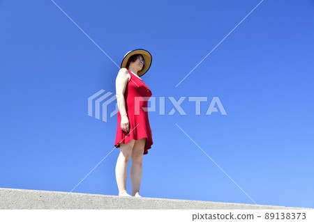 Taking a portrait of a woman in a straw hat at Sawara Fishing Port in Mori Town, Hokkaido Taking a portrait of a woman in a straw hat at Sawara Fishing Port in Mori Town, Hokkaido 89138373