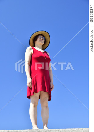 Taking a portrait of a woman in a straw hat at Sawara Fishing Port in Mori Town, Hokkaido Taking a portrait of a woman in a straw hat at Sawara Fishing Port in Mori Town, Hokkaido 89138374