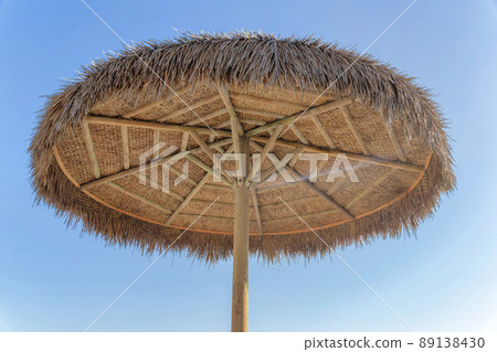 Nipa umbrella against the clear sky background at San Clemente, Orange County, California 89138430
