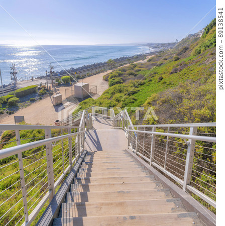 Staircase on a slope with a view of the train tracks and beach at San Clemente, California 89138541